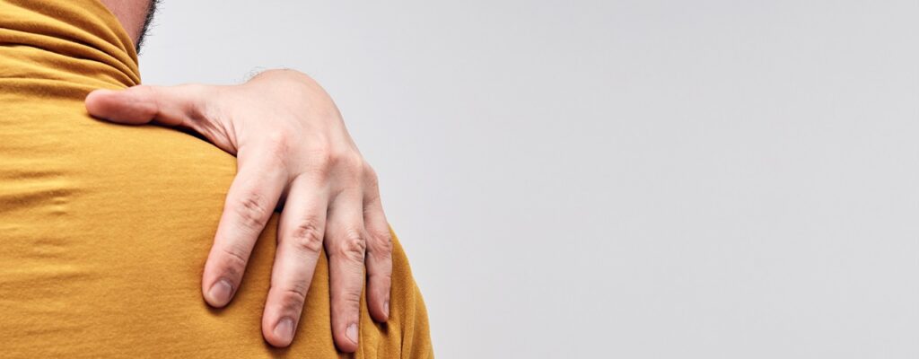 Adult caucasian man with shoulder pain.